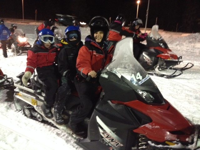 Exploring on snowmobiles on a family adventure to Lapland