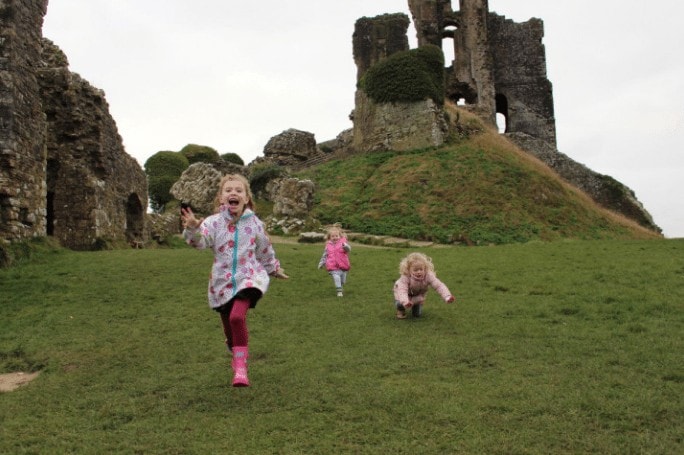 Children running, enjoying and exploring a National Trust day out in Dorset