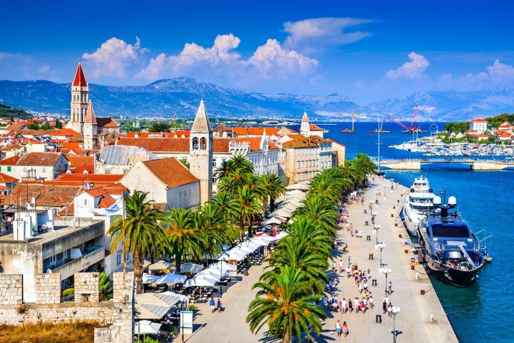 Trogir, Croatia. Sunny promenade along the pier of old Venetian town, Dalmatian Coast in Croatia.