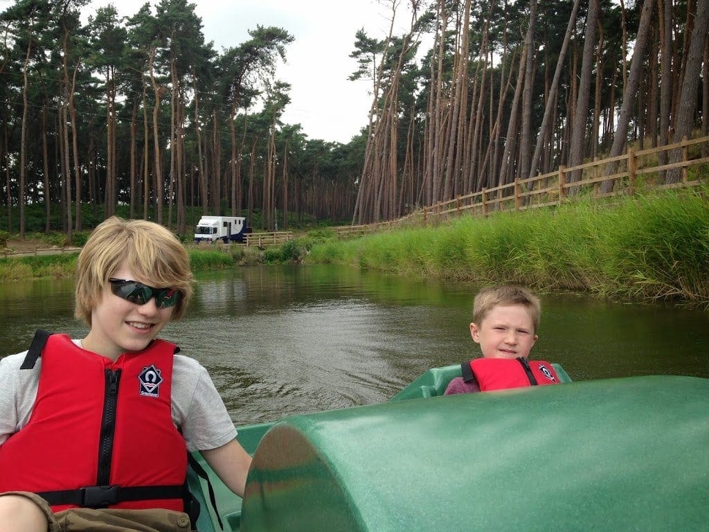 two boys on a pedalo, august in center parcs