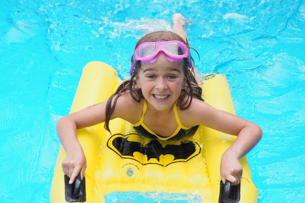 Child wearing DC Super Heroes Swimwear from Zoggs - a great thing to pack in your 'always ready' beach bag